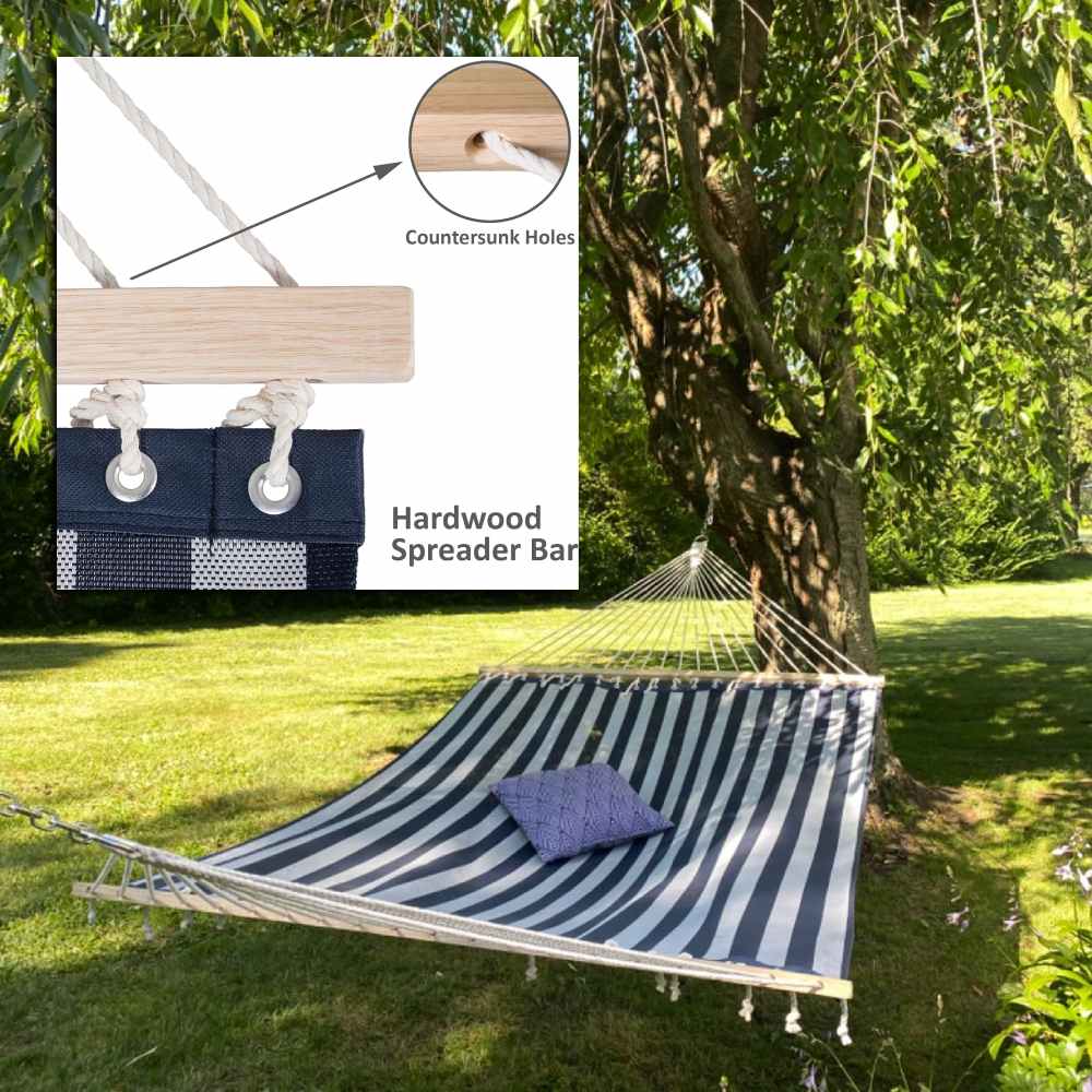A flat hammock held open by hardwood spreader bars